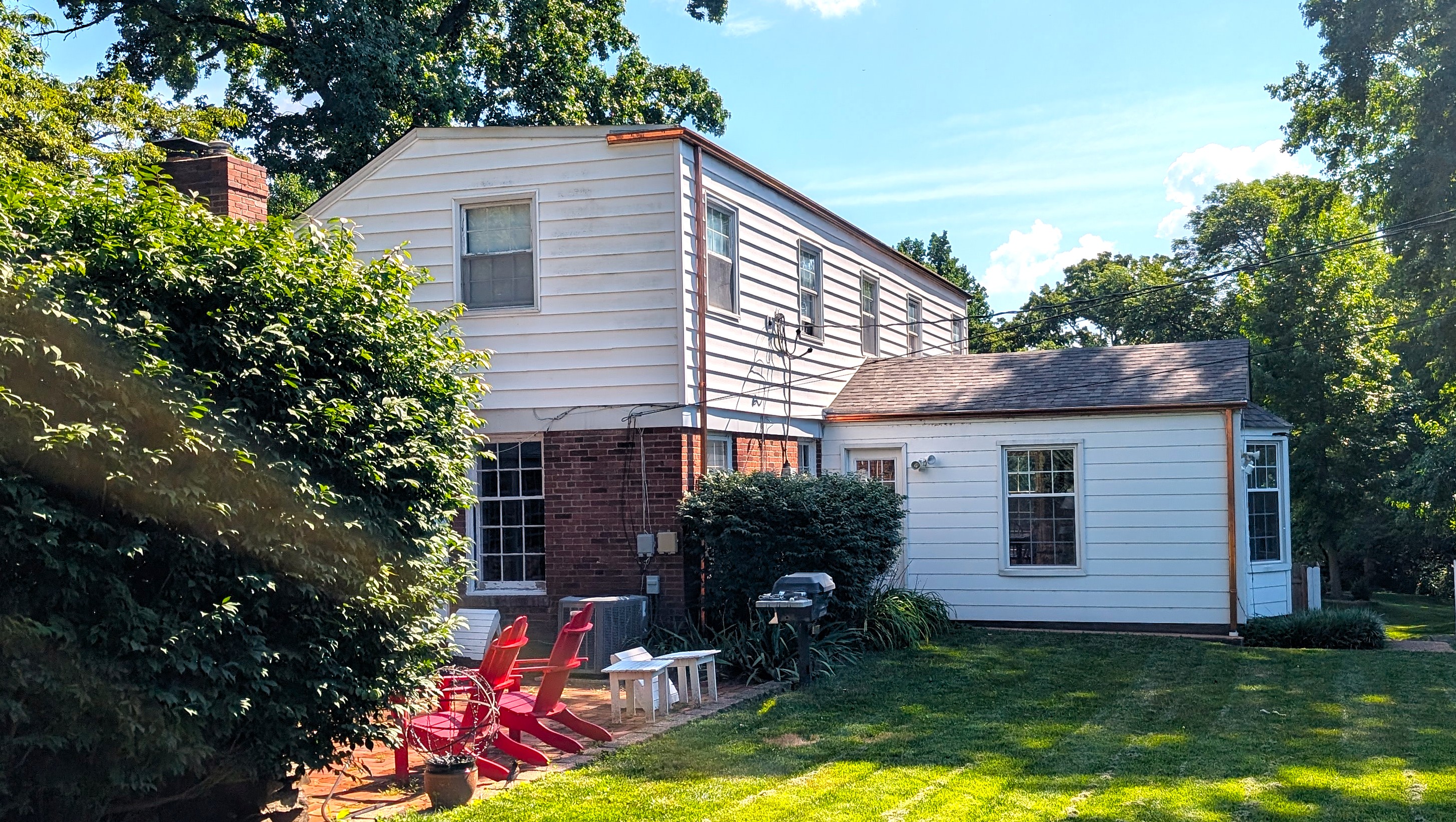 Close-up of seamless aluminum K-style gutters with hidden hangers on a DFW home