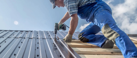 McElroy Metal standing seam panels being installed by Greenleaf Roofing crew